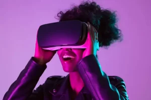 Image of a woman putting on a Virtual Reality Goggles